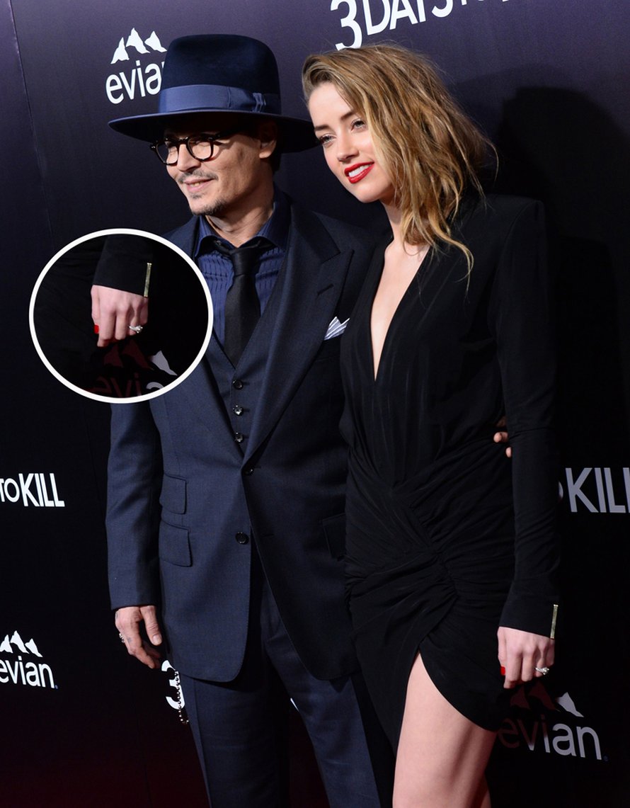 Johnny Depp ja Amber Heard keskiviikkona 3 Days To Kill -elokuvan ensi-illassa. Parin on huhuttu menevän naimisiin Johnnyn yksityissaarella Bahamalla. Kuva MVphotos